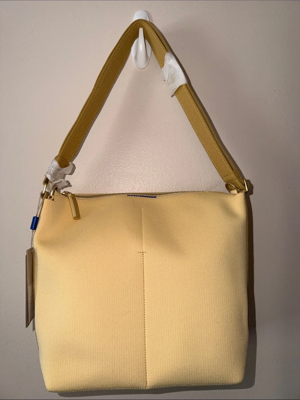 Rothy’s The Mini Zip Bucket Bag in Golden Wheat